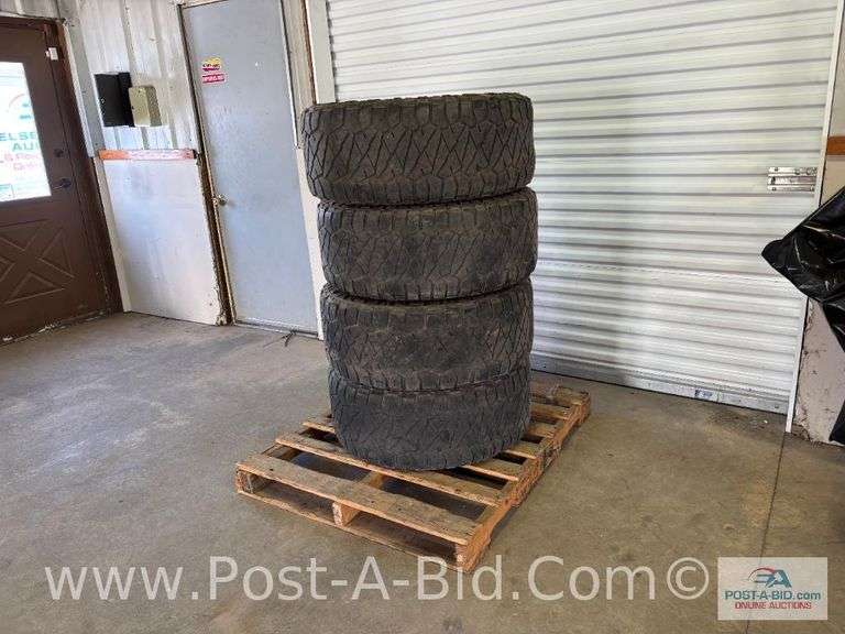 4- Nitto Tires, Size LT 325/66R 18 On 8 Bolt Rims.