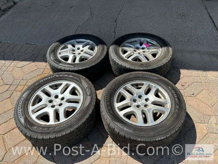 4-Goodyear Assurance Tires 225/60 R16 On Subaru Rims.