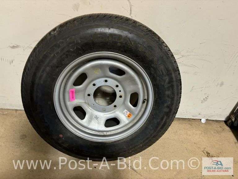 Continental Used Tire LT 275/65 R18 On 8 Bolt Rim.