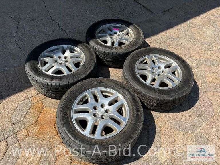 4-Goodyear Assurance Tires 225/60 R16 On Subaru Rims.