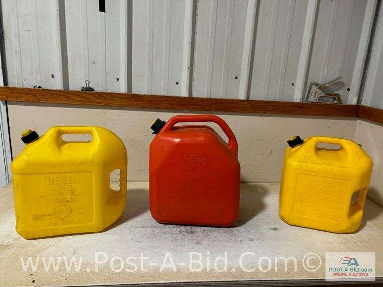 2-5 Gallon Diesel Cans And 1-6 Gallon Gas/Can.