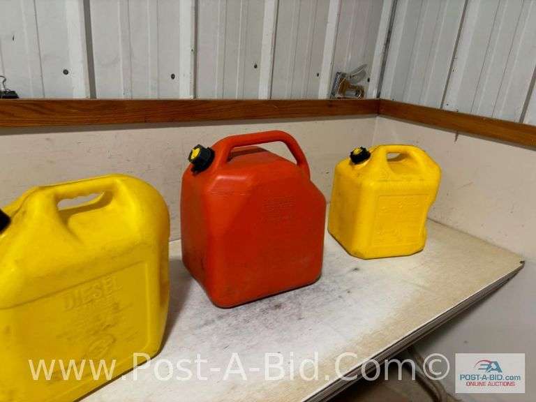 2-5 Gallon Diesel Cans And 1-6 Gallon Gas/Can.