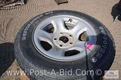 4-Firestone 245/65 R17 Tires, With Center Caps And Lugs, Owner Stated, "Wer