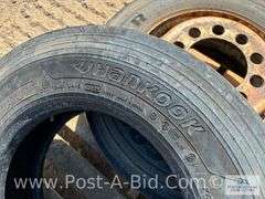 1-Hankook 215/75 R17.5 Tire and 1-Goodyear 215/75 R17.5 Tire On Steel Rim.