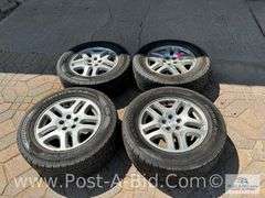 4-Goodyear Assurance Tires 225/60 R16 On Subaru Rims.