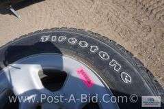 4-Firestone 245/65 R17 Tires, With Center Caps And Lugs, Owner Stated, "Wer