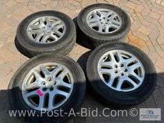 4-Goodyear Assurance Tires 225/60 R16 On Subaru Rims.