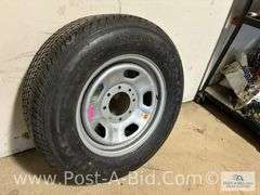 Continental Used Tire LT 275/65 R18 On 8 Bolt Rim.