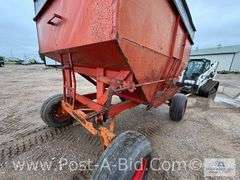 250 Bushel Gravity Box, With MN 10 Ton Running Gear.