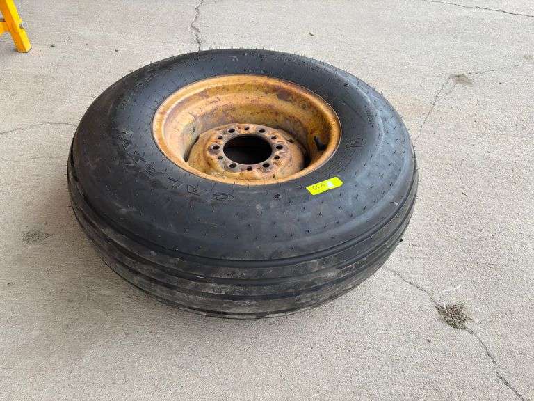 Brand New 11L-15 Tire On Rim.