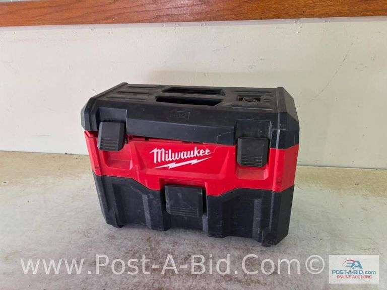 Milwaukee Portable Vacuum With No Battery, hose Is Taped In Multiple Places