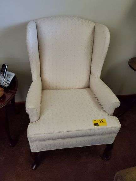 Wing-back upholstered chair by Pembrook Chair Company