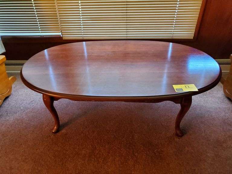 Oval coffee table with Queen Anne style legs