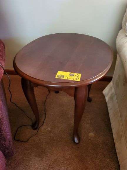 Pair of oval-top end tables with Queen Anne legs