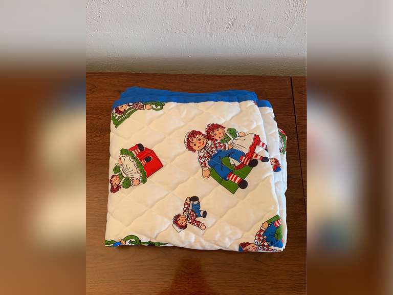 Child's quilt, raggedy ann blanket, and three little kittens blanket