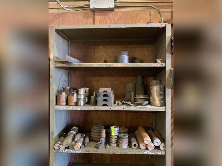 Top 3 shelves of oil field pieces parts and accessories