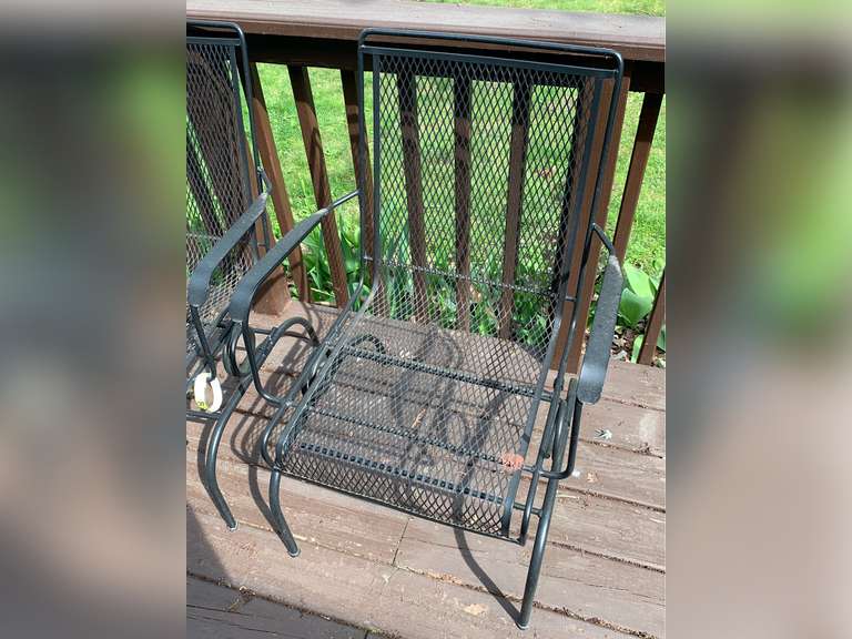 2 spring-loaded rocking black metal patio chairs - Parrott Marketing Group