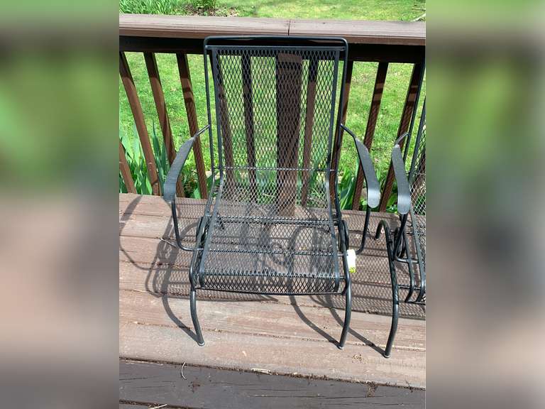 2 spring-loaded rocking black metal patio chairs - Parrott Marketing Group