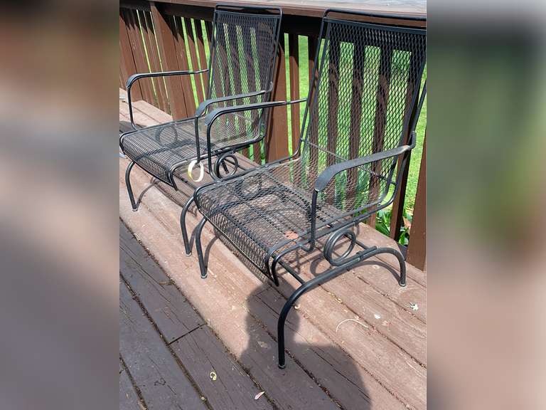 2 spring-loaded rocking black metal patio chairs - Parrott Marketing Group