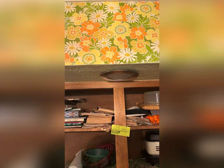 Top shelf of cabinet to the right of sink
