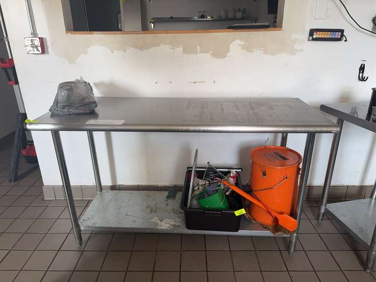 Steelton Metal Products stainless steel work table, model number 522ETSG2460. Economy-grade work table made with 18-gauge, type 430 stainless steel. 
The table dimensions are 24" x 60". NSF.
Galvanized steel legs and an adjustable undershelf.