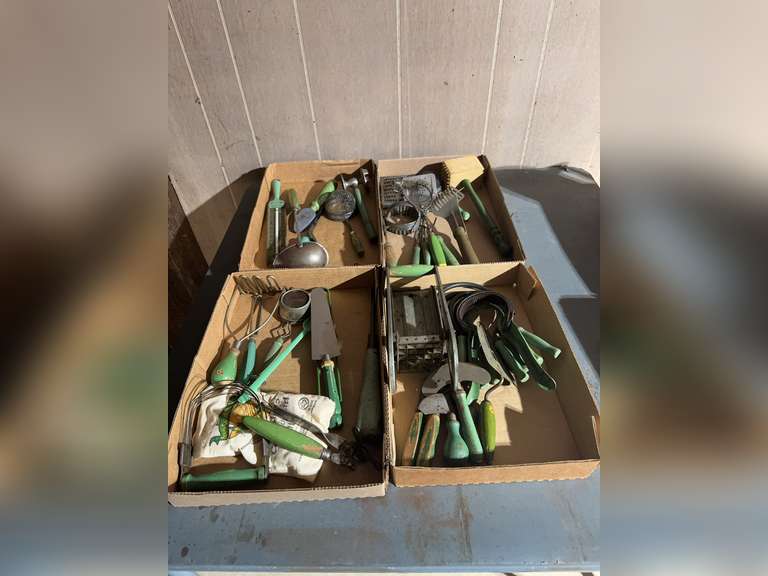 4 boxes of green handled kitchen utensils
