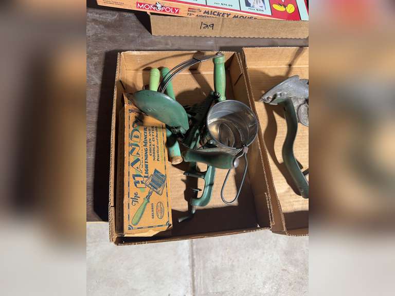 2 boxes of green handled kitchen utensils