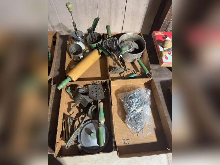 4 boxes of green handled kitchen utensils