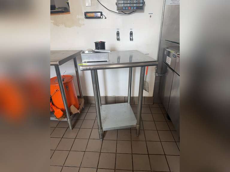 Steelton Metal Products work table with the model number 522ETSG2424.
18-gauge, type 430 stainless steel work table. NSF.
Rolled front edge and galvanized steel legs and undershelf.