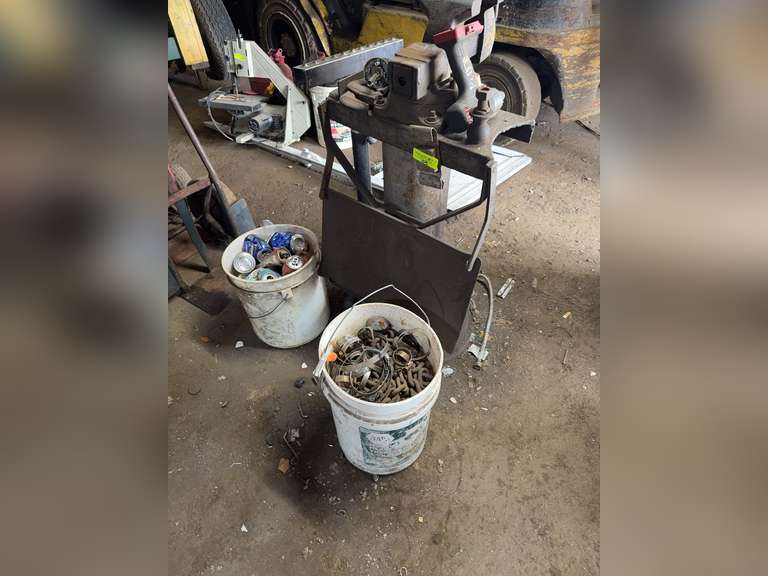 Bucket of chains, bucket of cans, vice, and stand
