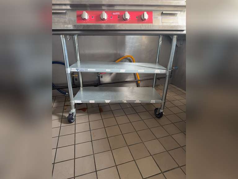 Steelton Metal Products work table, model number 522ETSG2448. Commercial-grade stainless steel work table. NSF certified. 
Material: 18 gauge, type 430 stainless steel top with galvanized steel legs.
Intended Use: Designed for light-duty tasks in commercial kitchens and other food service environments.