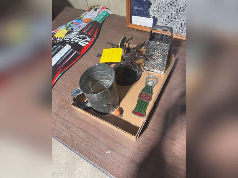 Rubber stamp holder, grater, bottle opener, sifter