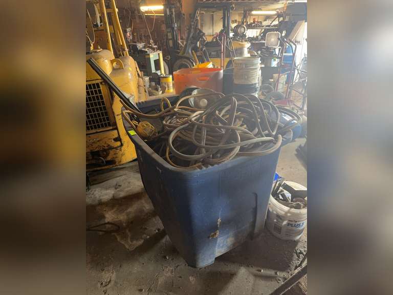 Tub of hoses and shop lights