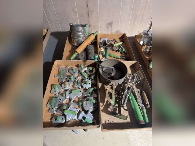 4 boxes of green handled kitchen utensils