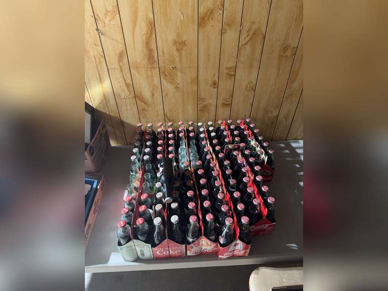 Large group of Coca-Cola 8-oz bottles