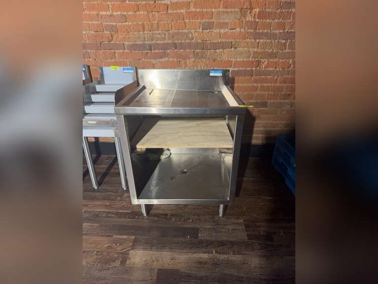 Underbar Glass Rack Unit, drainboard top, 24"W × 21"D × 32-1/2"H, open front base, adjustable rack slides, 18/304 stainless steel top with 3" backsplash & 1" NPS drain (BKDR-15CP), stainless steel legs, adjustable high impact corrosion resistant feet, NSF Weight: 195 Ibs total