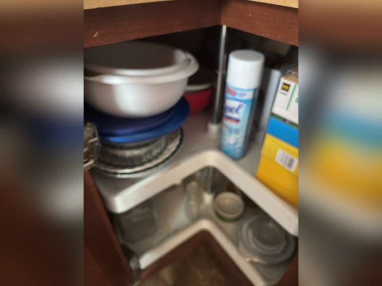 Lazy Susan with bowls, plates, and plastic ware and more