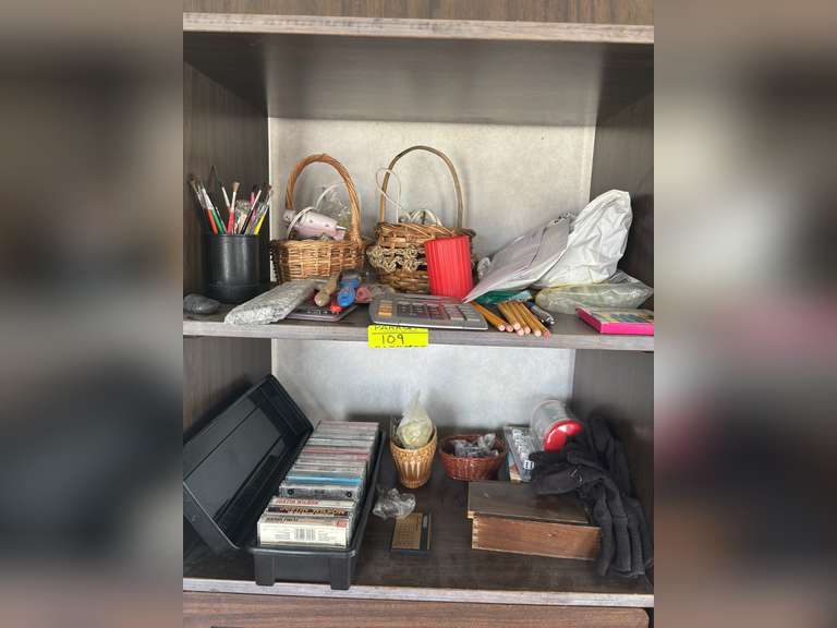 Contents of shelves with office supplies and etc.