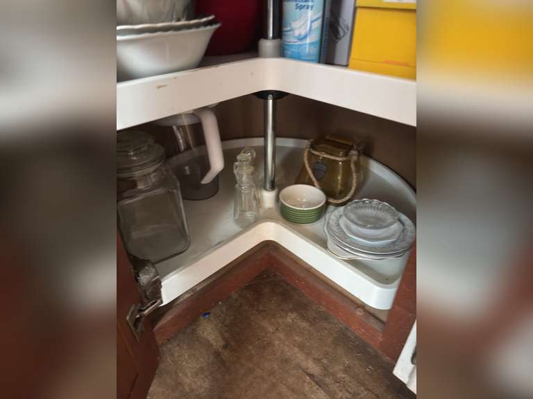 Lazy Susan with bowls, plates, and plastic ware and more