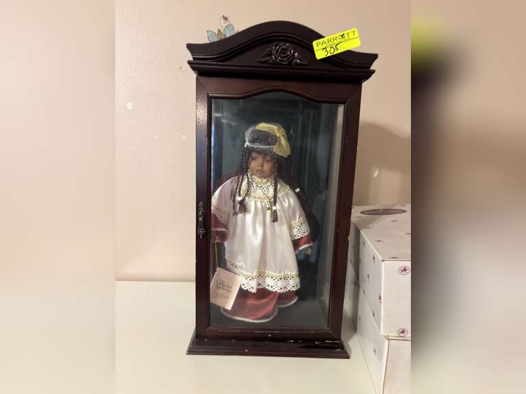 Paradise Galleries doll in display case