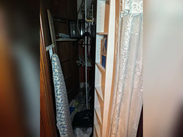 Contents of closet in entertainment room, (small six shelf cabinet with glass display case, walker a