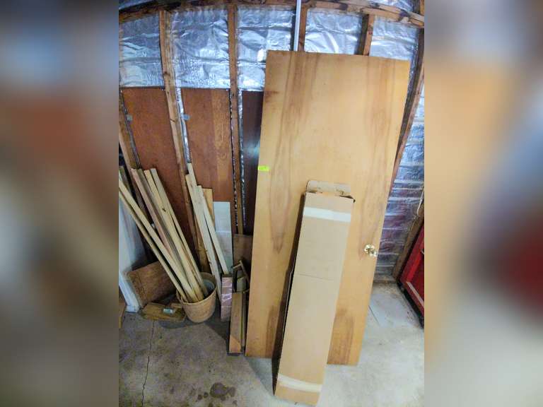 Back wall of wood misc, door, and etc.