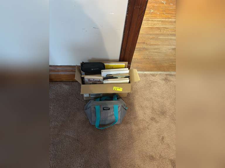 Box of religious books with igloo lunchbox