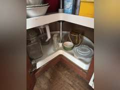 Lazy Susan with bowls, plates, and plastic ware and more