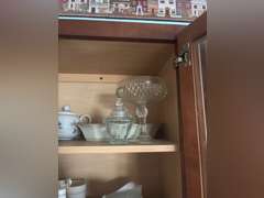 Shelf of Glassware (covered candies and other glass dishware)