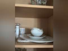 Shelf of glassware ( eye washer, covered candy, toothpick holder, and other glassware
