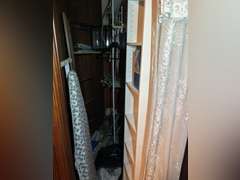Contents of closet in entertainment room, (small six shelf cabinet with glass display case, walker a