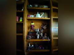 4 shelves of Americana, Ozark pillows, candle holders etc