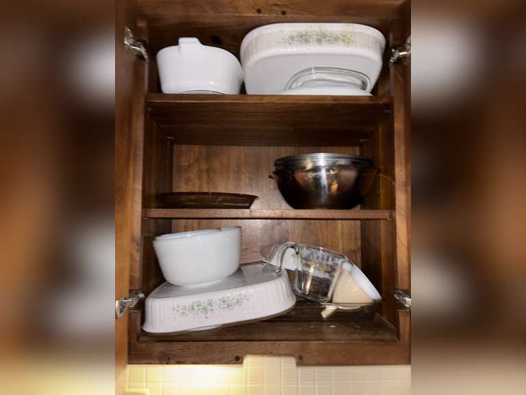 Contents of cabinet (baking dishes, & mixing bowls)