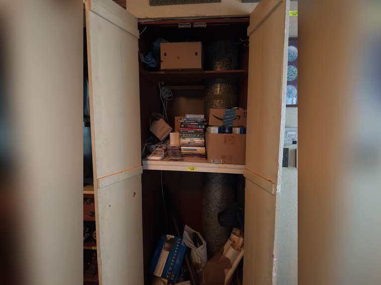 Contents of closet in living room (tv shows, movies on dvds, cds) and more